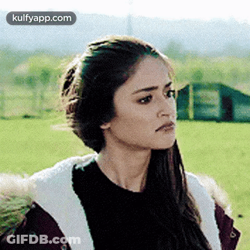 Woman In Fur Coat And Black Sweater In Field GIF