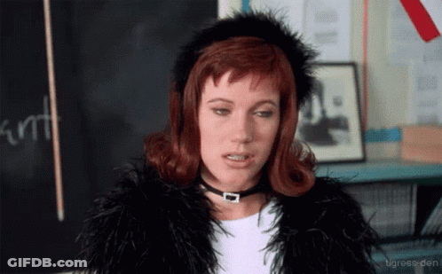 Woman In Fur Coat And Choker Blackboard Saying Kurt GIF