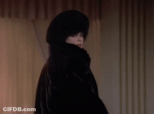 Woman In Fur Coat And Hat Smiling GIF