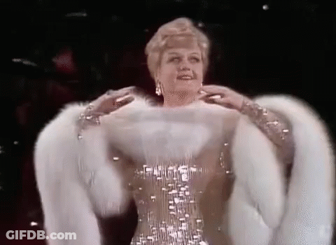 Woman In Fur Coat And Sequin Dress GIF
