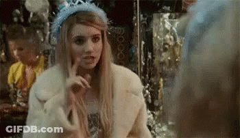 Woman In Fur Coat And Tiara Making Funny Face GIF