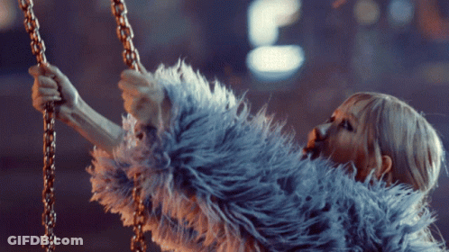 Woman In Fur Coat Holding Chain GIF