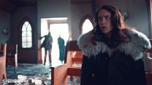 Woman In Fur Coat In Front Of Church GIF