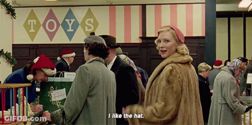 Woman In Fur Coat In Front Of Toys Sign GIF