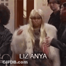 Woman In Fur Coat Says Liz Anya GIF