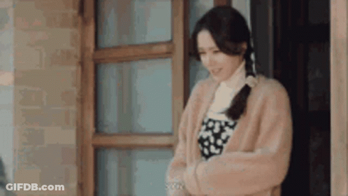 Woman In Fur Coat Standing GIF