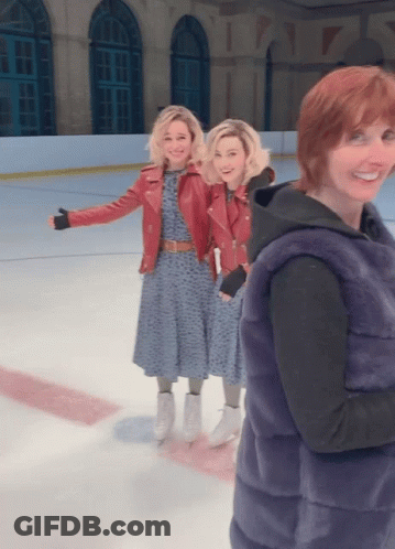 Woman In Fur Vest With Two Women On Ice GIF