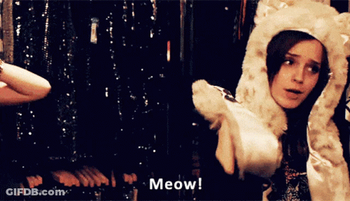 Woman In Furry Hat Meows GIF