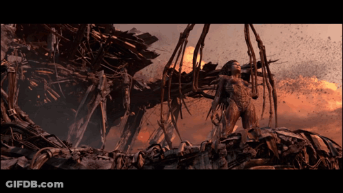 Woman In Futuristic Outfit Before Destroyed Structure GIF