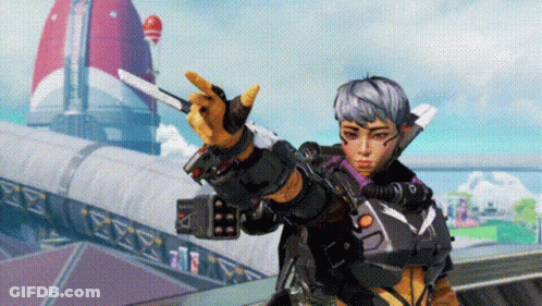 Woman In Futuristic Outfit Holding Gun And Making Peace Sign GIF