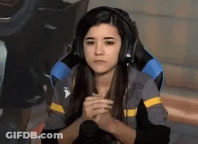 Woman In Gaming Chair Headphones Folded Hands GIF