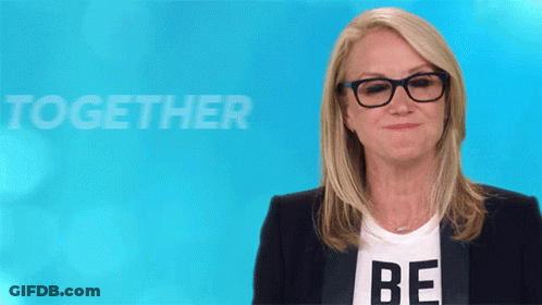 Woman In Glasses And Be Shirt GIF
