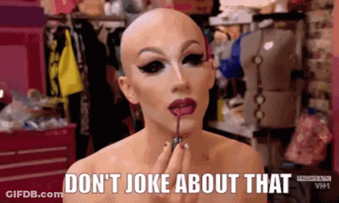 Woman In Glasses And Beanie Saying Not Funny GIF