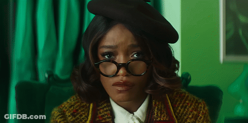 Woman In Glasses And Beret Looking Sad GIF