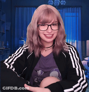 Woman In Glasses And Black Adidas Jacket Smiling GIF