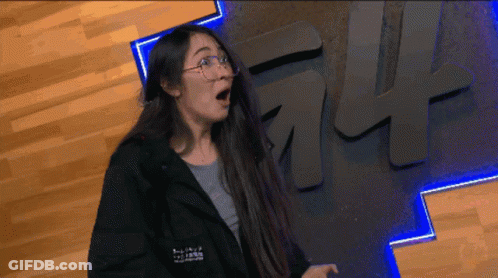 Woman In Glasses And Black Jacket With Ff Sign GIF