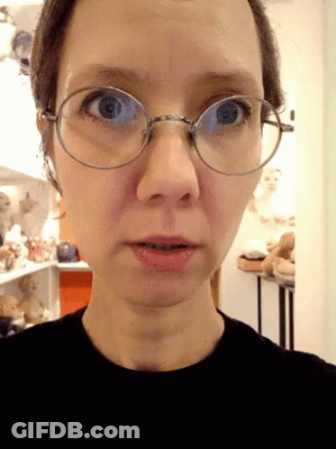 Woman In Glasses And Black Shirt GIF