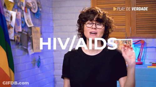 Woman In Glasses And Black Shirt Says HIV/AIDS GIF