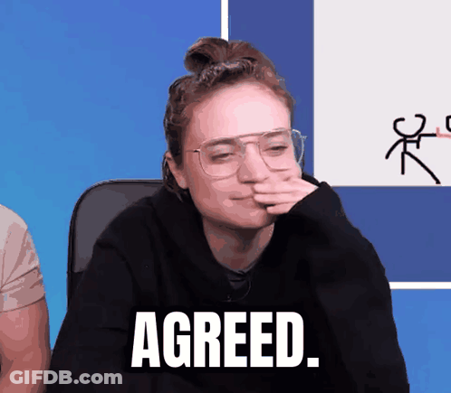 Woman In Glasses And Black Sweater Saying Agreed GIF