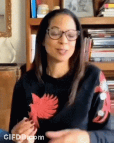 Woman In Glasses And Black Sweater With Red Bird Sleeves GIF