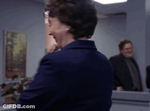 Woman In Glasses And Blue Jacket GIF