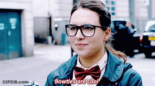 Woman In Glasses And Bow Tie Saying Bowties Are Cool GIF
