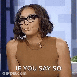 Woman In Glasses And Brown Tank Top Making Funny Face GIF