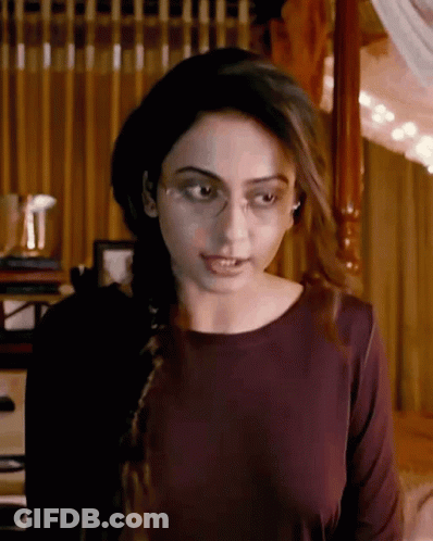 Woman In Glasses And Burgundy At Four Poster Bed GIF
