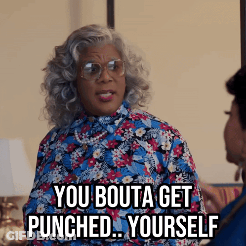 Woman In Glasses And Floral Shirt Saying You Bouta Get Punched Yourself GIF