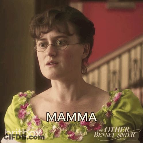 Woman In Glasses And Green Flower Dress Says Mamma GIF
