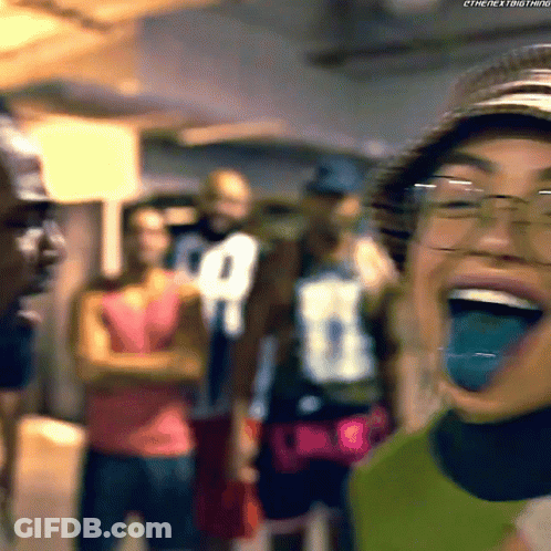 Woman In Glasses And Hat Laughing With Tongue Out GIF