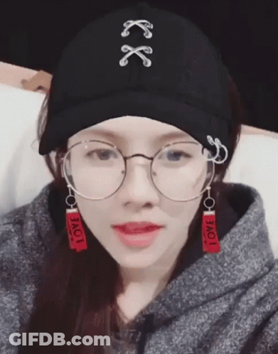 Woman In Glasses And Hat Saying Love GIF