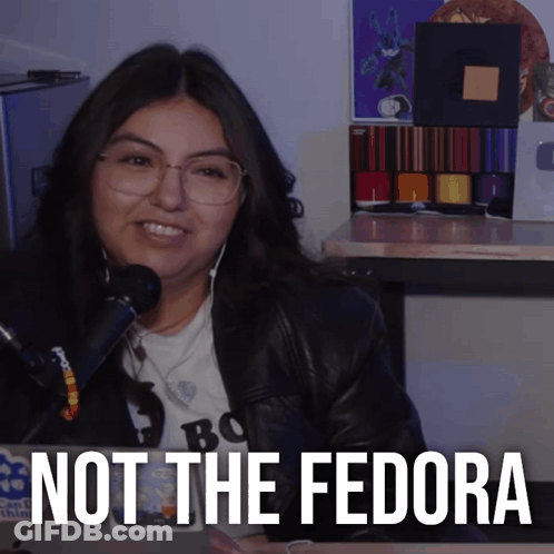 Woman In Glasses And Leather Jacket Smiling Not The Fedora GIF