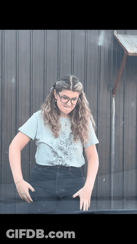 Woman In Glasses And Light Blue Shirt GIF