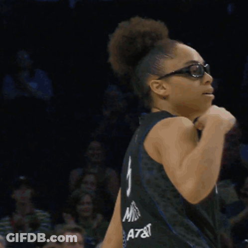 Woman In Glasses And Lynx Jersey Flexing Arm GIF