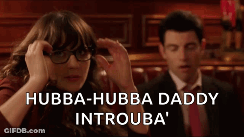 Woman In Glasses And Man In Suit Sitting In Bar GIF