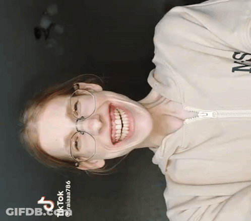 Woman In Glasses And Ms Hoodie Smiling GIF