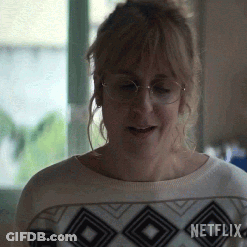 Woman In Glasses And Netflix Sweater GIF