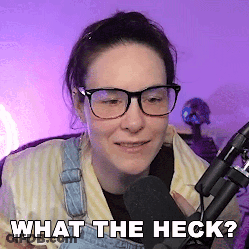 Woman In Glasses And Overalls Says What The Heck GIF