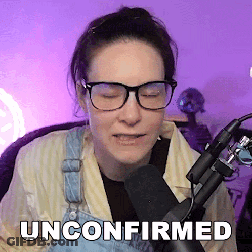 Woman In Glasses And Overalls Sitting In Front Of Microphone Unconfirmed GIF