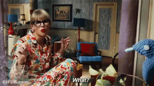 Woman In Glasses And Pajamas Talking To Stuffed Animal GIF