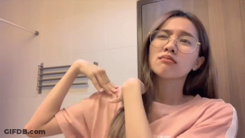 Woman In Glasses And Pink Shirt With Letter S GIF