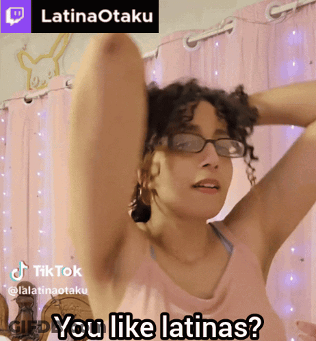 Woman In Glasses And Pink Tank Top Asking If She Likes Latinas GIF