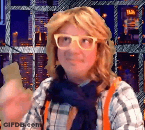 Woman In Glasses And Plaid Shirt In City GIF