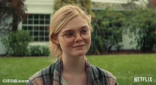 Woman In Glasses And Plaid Shirt Smiling Netflix Ad GIF