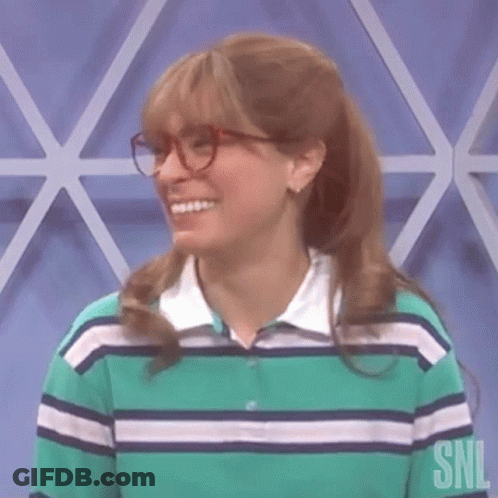 Woman In Glasses And Striped Shirt Smiling GIF