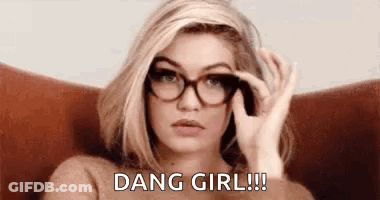 Woman In Glasses And Sweater Sitting In Chair GIF