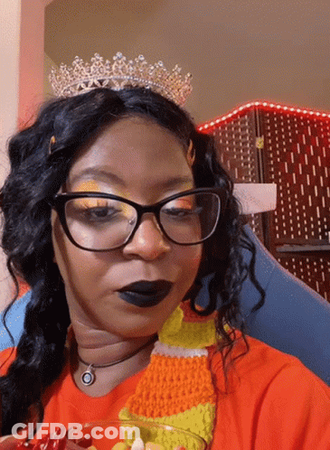 Woman In Glasses And Tiara Holding Candy Corn GIF