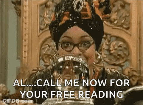 Woman In Glasses And Turban Holding Crystal Ball GIF