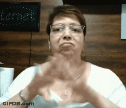 Woman In Glasses And White Shirt Making Funny Face GIF
